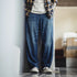 Premium Retro Splash Denim Jeans in straight fit on a model standing in a modern setting.